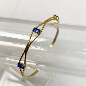 Gold tone delicate Blue emerald cut rhinestone cuff bracelet